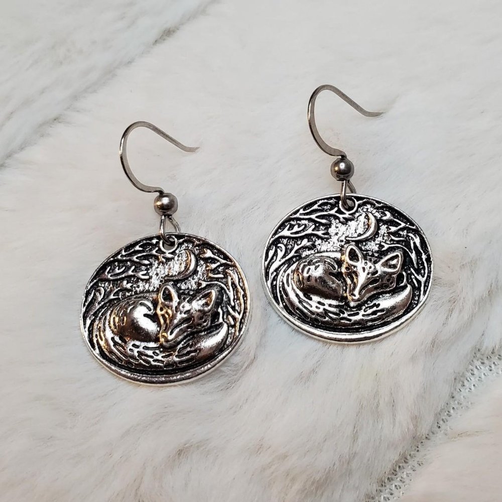 Sleeping fox charm earrings.